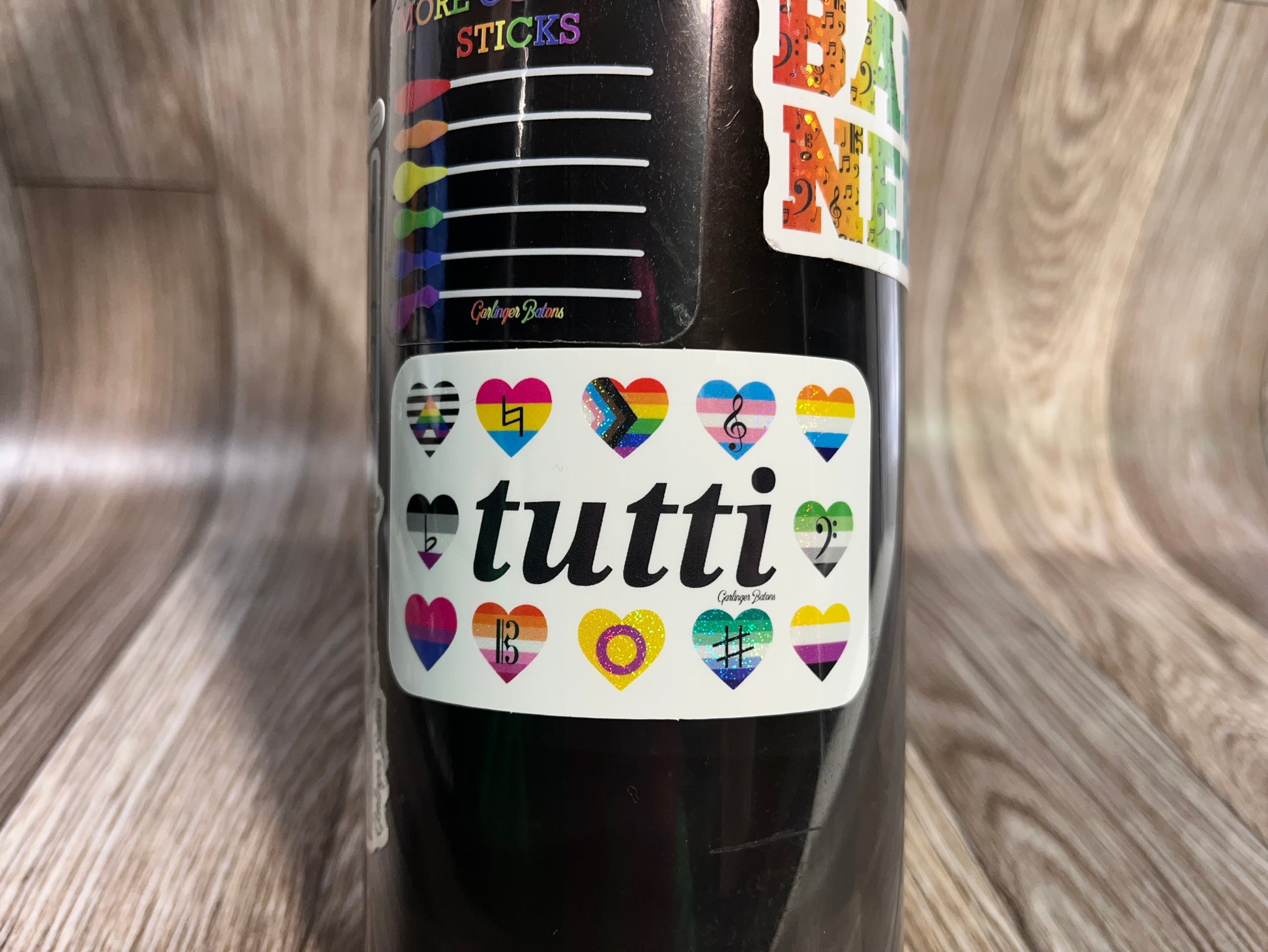 Glitter gay pride sticker on waterbottle