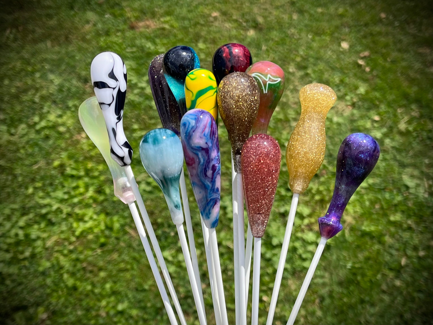 A group of colorful conducting batons with acrylic handles